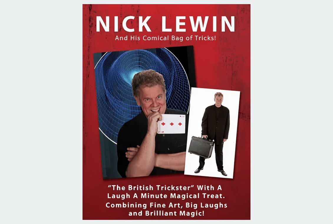 Magician holding playing cards and smiling