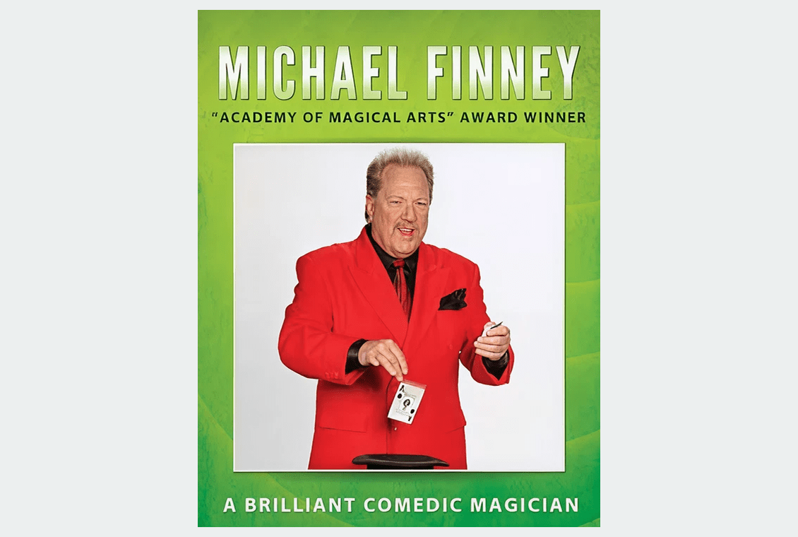 Award-winning magician holding a playing card